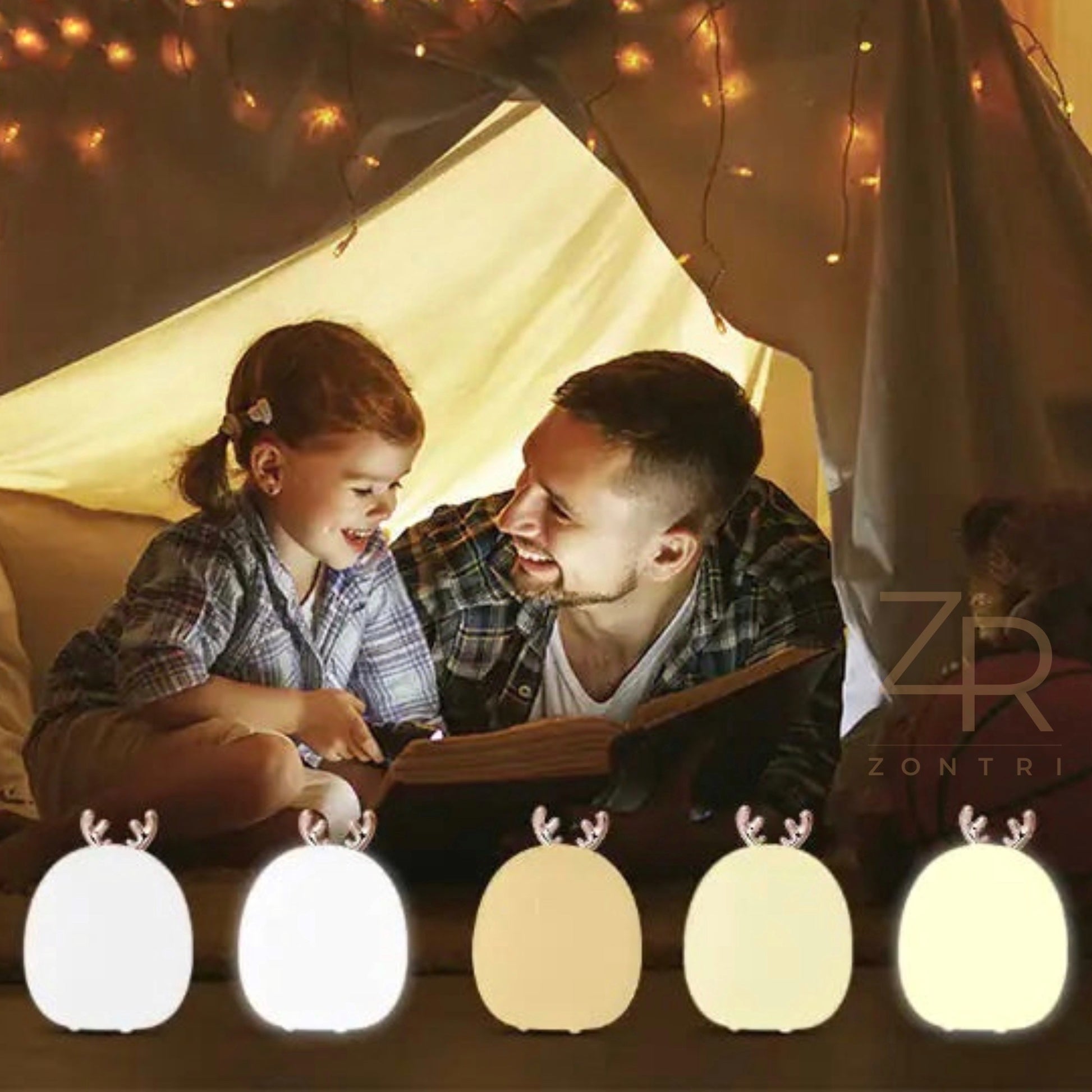 Father and daughter reading a bedtime story inside a cozy tent, illuminated by multiple soft silicone rabbit and deer night lights.