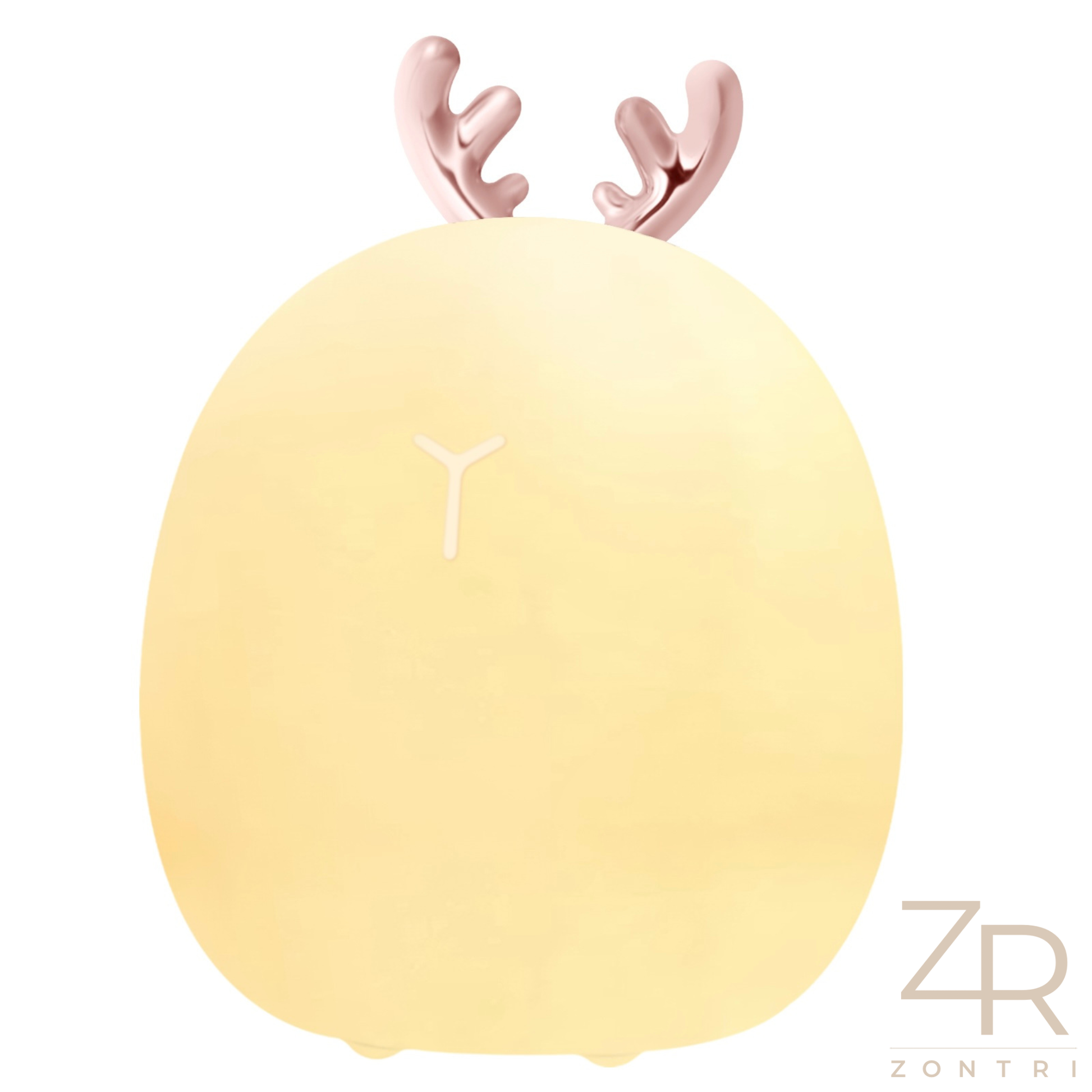 Close-up of a deer silicone night light placed on a stack of books, adding a cozy golden glow to the room.