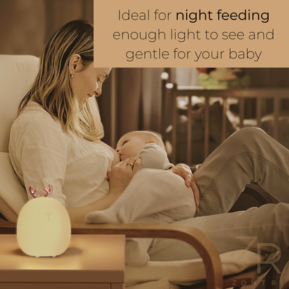 Mother breastfeeding her baby at night with a deer night light on the side table and a banner about night feeding benefits.