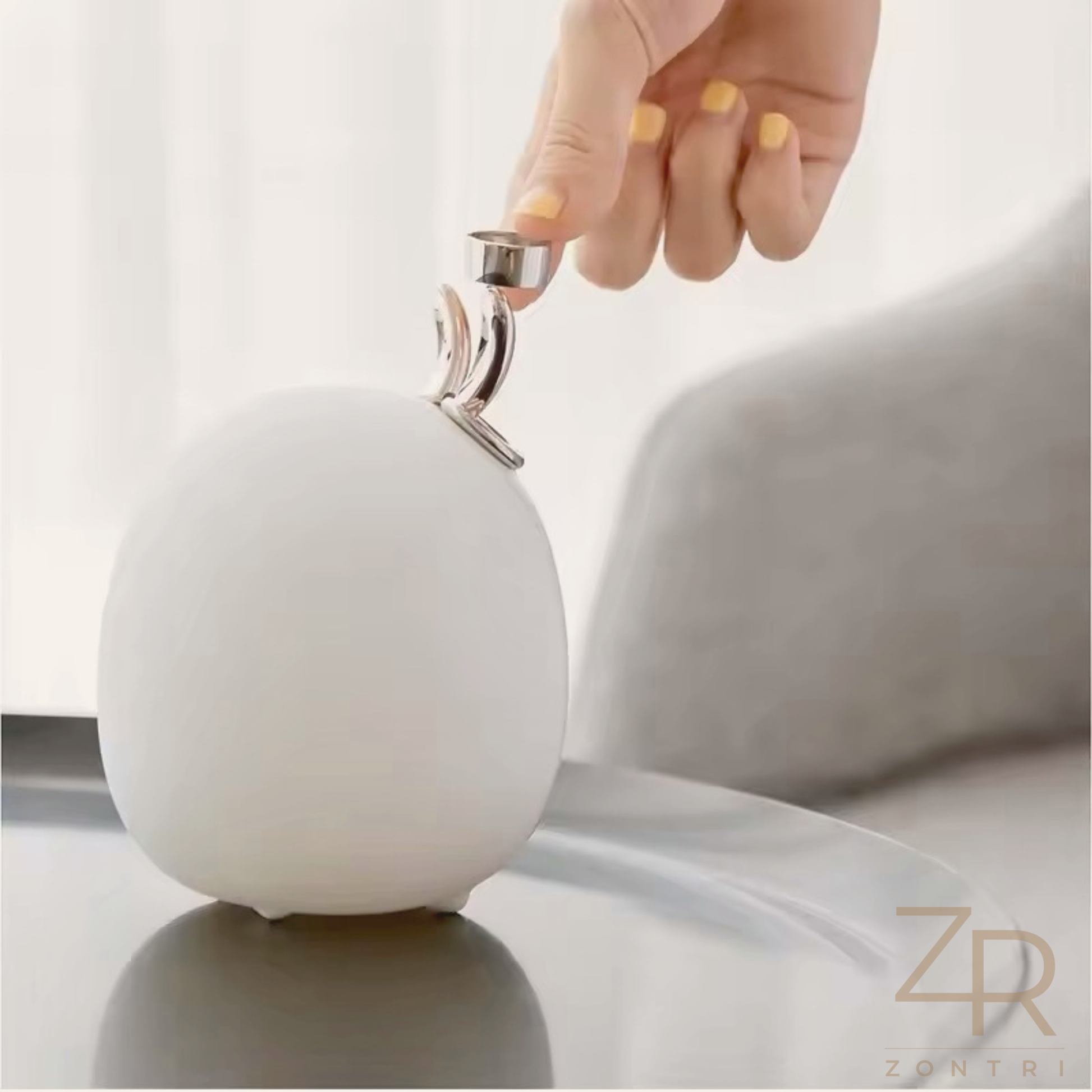 Warm glowing bunny night light on a bedside table next to parents and newborn during night feeding.