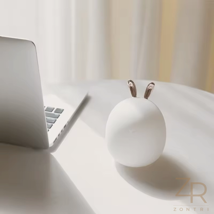 Single bunny or deer silicone night light photographed on a plain light background to show its simple design.