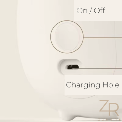 Styled nursery shelf or sideboard decorated with books, toys and a glowing silicone rabbit or deer night light. Photo showing On/Off charging mode.