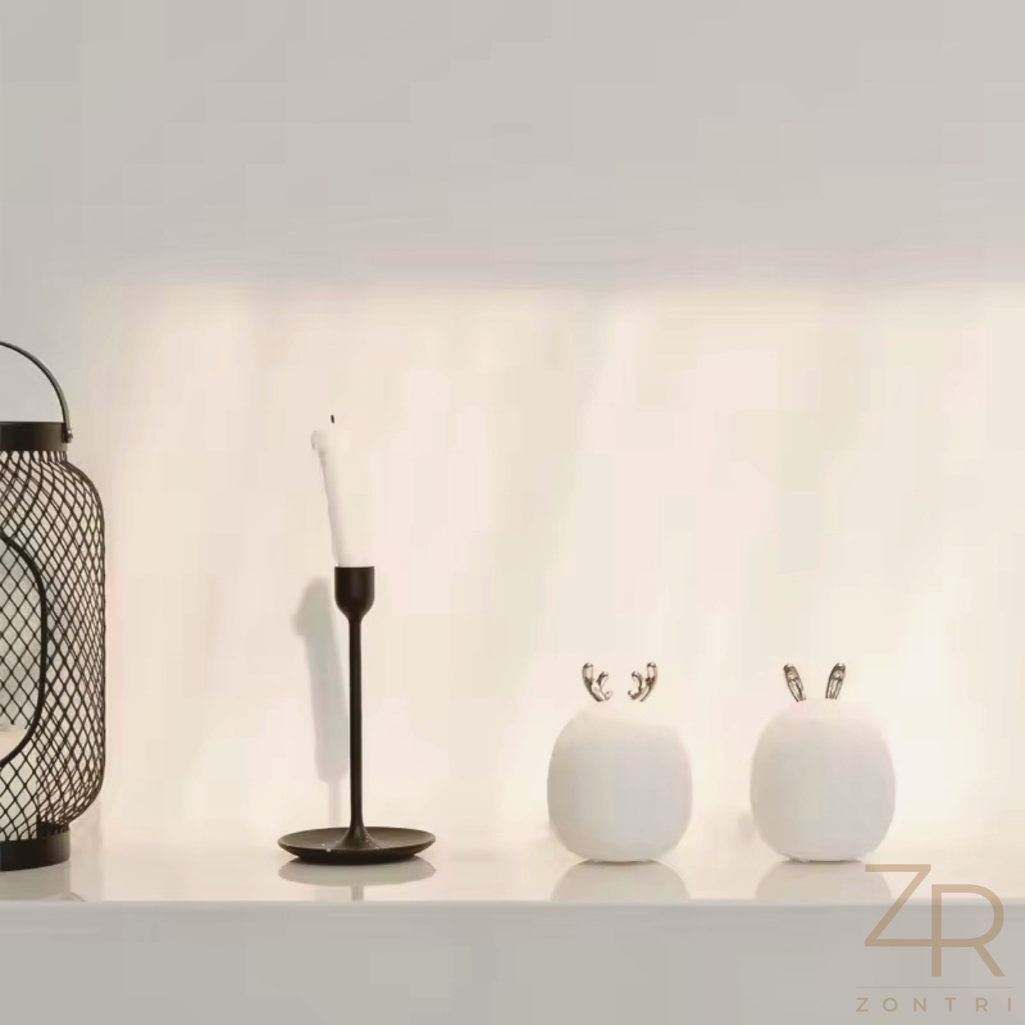 Silicone rabbit and deer night lights placed on white table, adding cozy illumination to the scene.