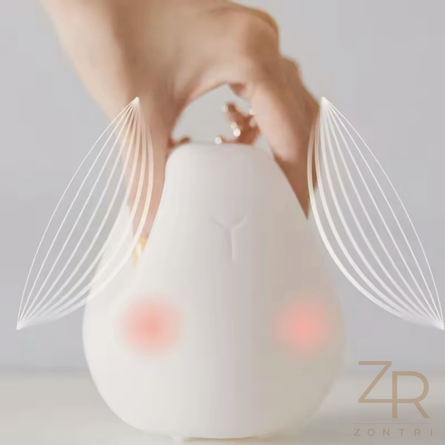 Photo showing he silicone deer night light with touch control base.