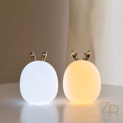 Image comparing warm white and cool white lighting modes of the silicone baby night lamp.